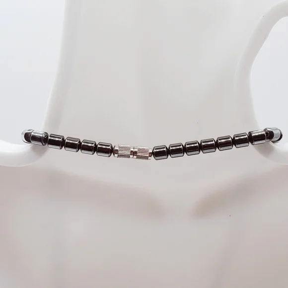 Hematite With Carved Mother Of Pearl Ivory Claw Pendant Necklace